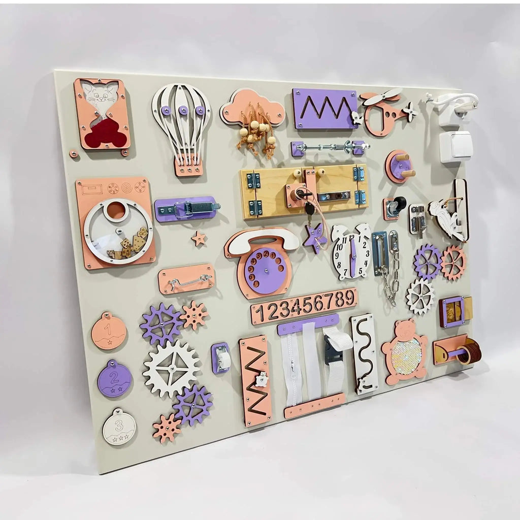 Children's educational board with various shaped and colored magnetic pieces on a white background