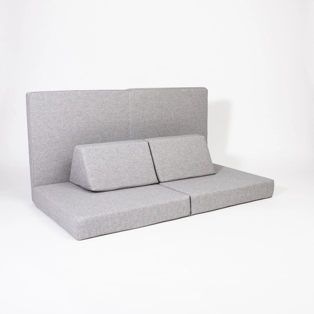 Gray upholstered bench with backrest on a white background