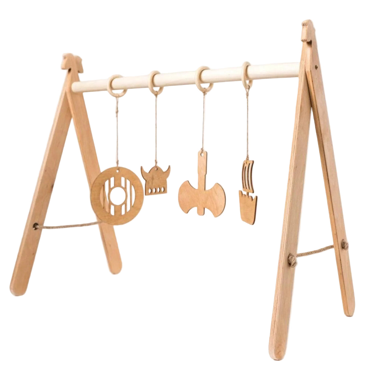 Wooden play gym with hanging toys on a white background