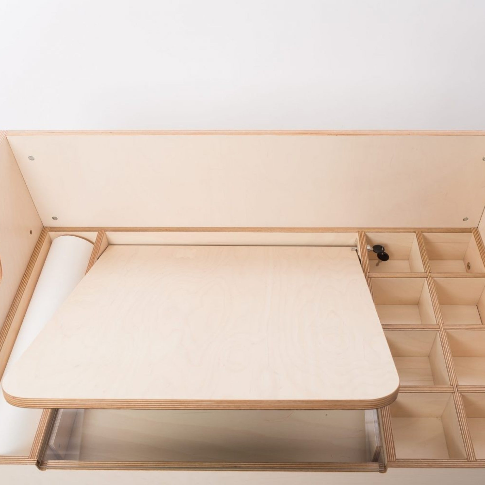 Montessori-inspired wooden art desk with paper roll and storage compartments
