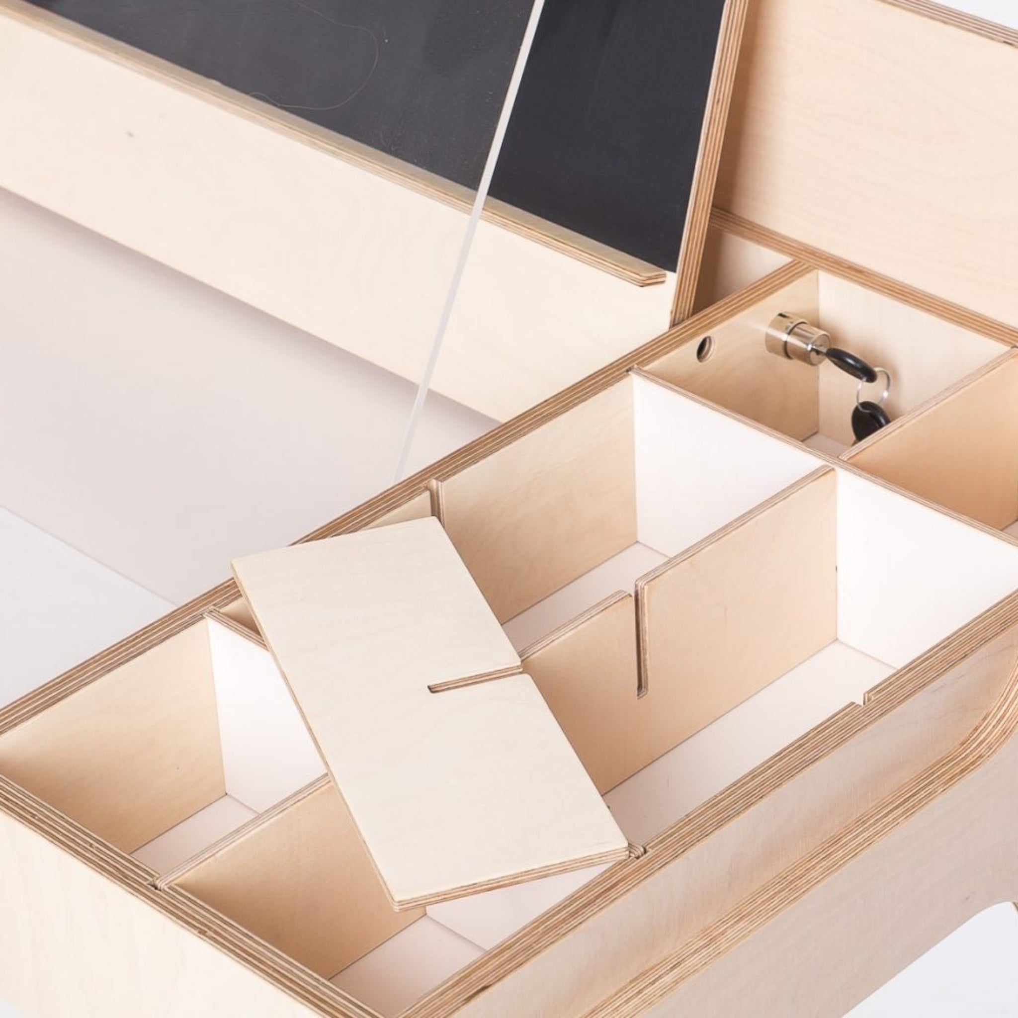 Montessori-inspired wooden sensory table with open compartments and removable lid