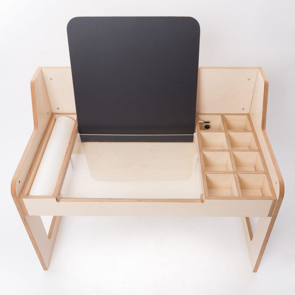 Montessori-inspired wooden art desk with storage compartments, roll paper holder, and chalkboard